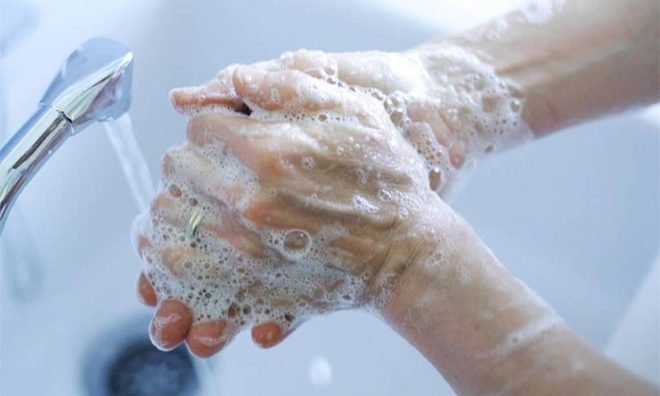 Washing your hands with soap and running water is one way to prevent the transmission of the corona virus